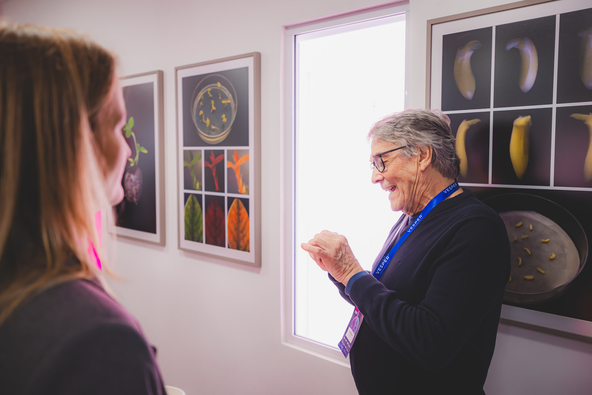 Distinguished visitor examining Vesper biotechnology research displays